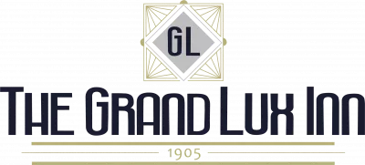 The Grand Lux Inn logo